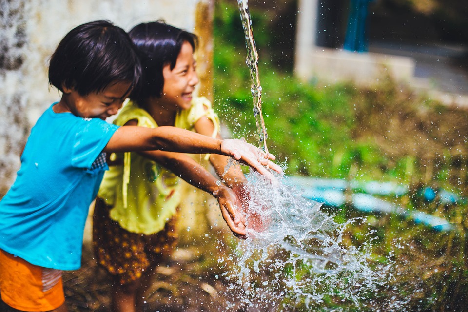 Image: Two children playing in water