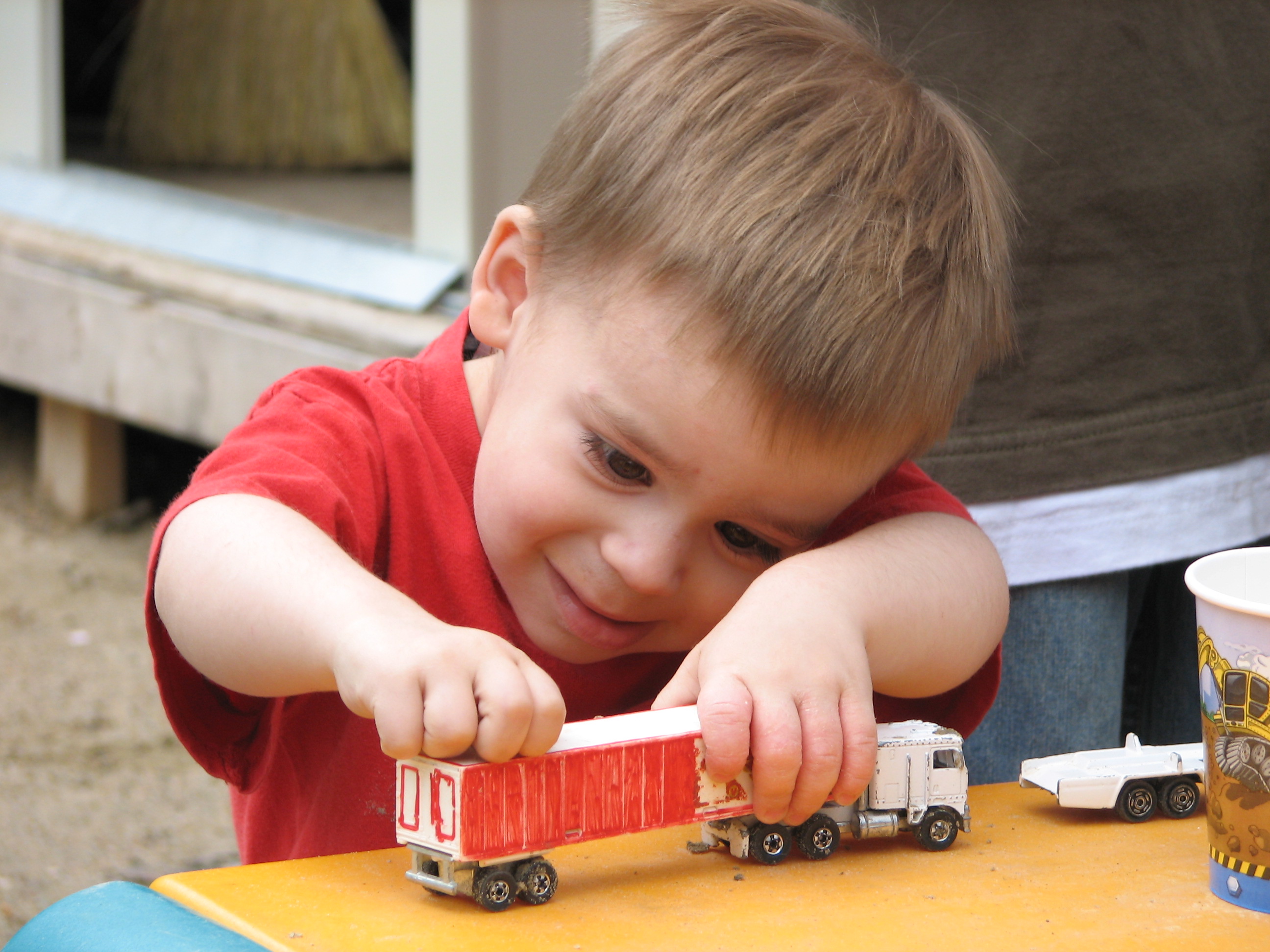 toddlers playing with trucks