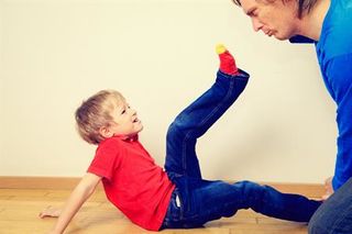 kid kicking another kid