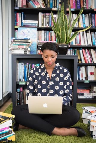 Woman sitting on floor, Unsplash