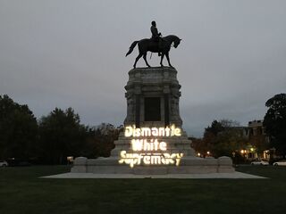  "Maryland Solidarity Brigade Projection - Dismantle White Supremacy on General Lee Statue in Richmond VA (Photos courtesy of Richmond DSA)" by Backbone Campaign is licensed under CC BY 2.0