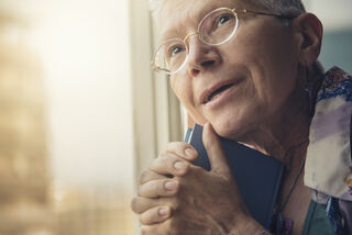 'Teodor Lazarev/Adobe Stock', 'Senior elderly lady feeling emotional over a romance novel, remembering her young love, licensed for use'.