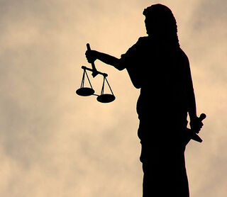 "The Shadow of Justice" by JMTimages on Flickr / CC BY-NC-ND 2.0