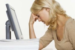 Frustrated woman in front of a computer