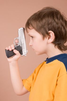 young boy with gun