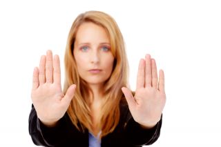 Person holding up hands in resistance