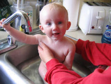 Baby in Kitchen Sink