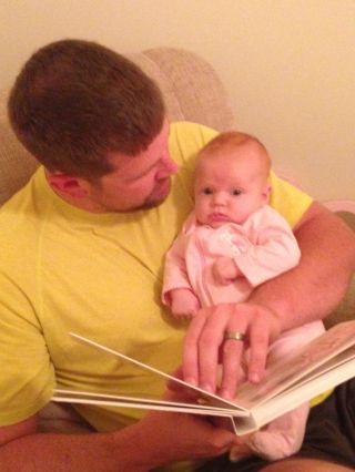 Dad reads to Baby Ruby Baby Ruby and Dad
