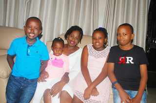 Dr. Sheila Clare Butungi and her children. Courtesy Dr. Butungi.