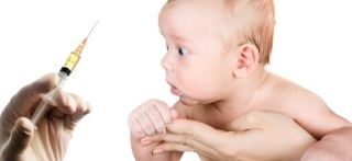 Baby-shocked-by-vaccine-needle/stock photo