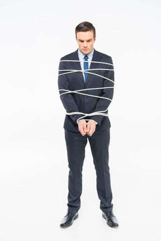 Young roped businessman–© silentgor Young roped businessman–© silentgor