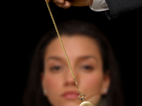 www.istockphoto.com Picture of woman being hypnotized with pocket watch