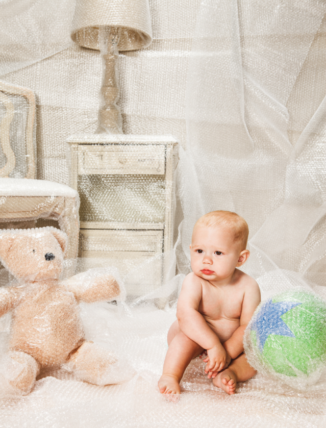 Baby in a bubble-wrapped nursery