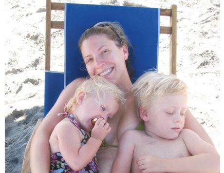 Nicole Kear on the beach with her children