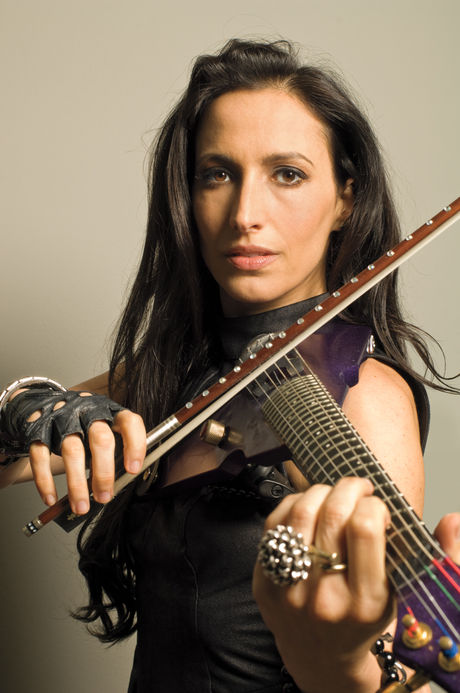 To her, playing her electric violin feels more like a form of meditation. Melvana playing the violin