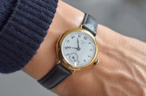Looking at watch impatiently