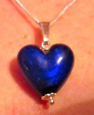 Heart transplant survivor Lynn Hunter wears this heart around her neck. Donate Life?