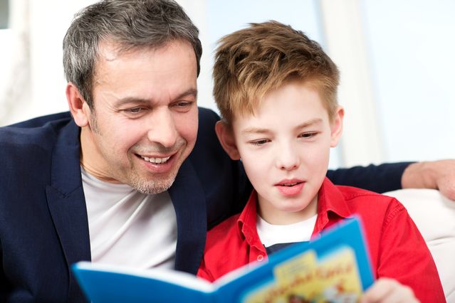 dad helping son read